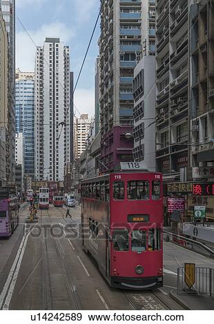 Double-decker tram on street in Hong Kong, China View Large Photo Image Stock Photo - Double-decker tram on street in Hong Kong, China. Fotosearch