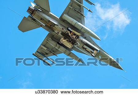 Dutch F-16 fighter plane taking part in NATO exercise Frysian flag, low angle against blue sky, Netherlands View Large Photo Image Stock Image - Dutch F-16 fighter plane taking part in NATO exercise Frysian flag, low angle against blue sky, Netherlands. Fotosearch