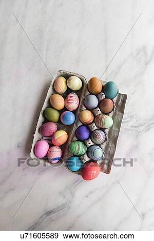 Dyed eggs in carton View Large Photo Image Stock Photo - Dyed eggs in carton. Fotosearch