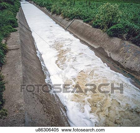 Stock Photography - Effluent from sewage treatment works discharging into a river estuary, UK.. Fotosearch