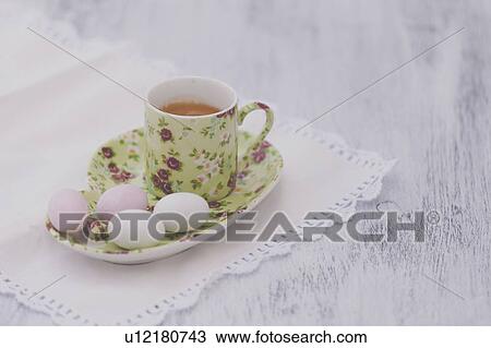 Stock Image - Eggs on floral plate with matching cup of tea. Fotosearch