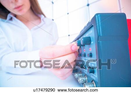 Stock Image - Electrical engineer in laboratory.. Fotosearch