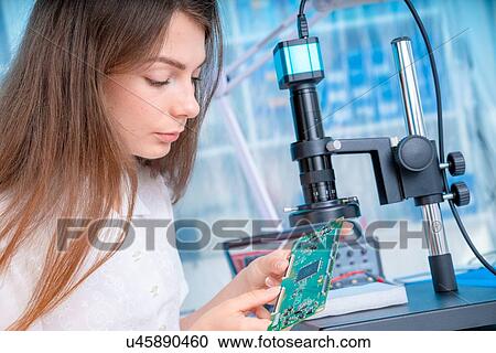 Stock Image - Engineer with circuit board.. Fotosearch