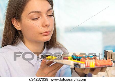 Stock Photo - Engineer with circuit board.. Fotosearch