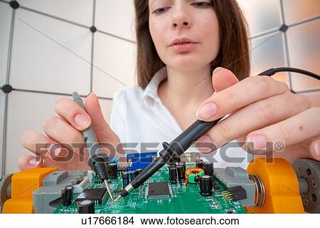 Picture - Engineer working on circuit board.. Fotosearch