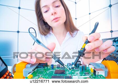 Engineer working on circuit board. View Large Photo Image Stock Image - Engineer working on circuit board.. Fotosearch