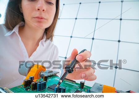 Engineer working on circuit board. View Large Photo Image Stock Image - Engineer working on circuit board.. Fotosearch