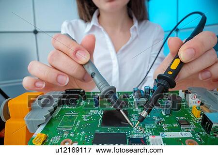 Engineer working on circuit board. View Large Photo Image Stock Photo - Engineer working on circuit board.. Fotosearch