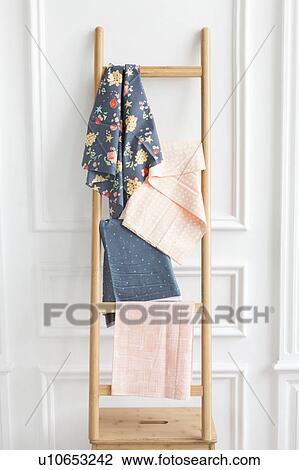 Stock Image - Fabric on rack. Fotosearch