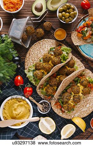 Falafel wraps with ingredients View Large Photo Image Stock Photo - Falafel wraps with ingredients. Fotosearch