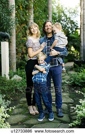 Stock Photograph - Family in garden. Fotosearch