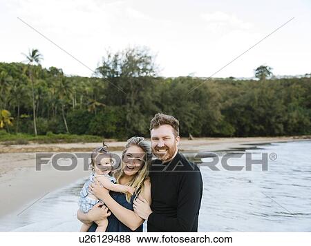 Stock Photo - Family on beach. Fotosearch