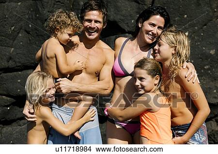 Family portrait on rocks at beach View Large Photo Image Picture - Family portrait on rocks at beach. Fotosearch