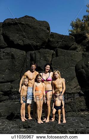 Family portrait on rocks at beach View Large Photo Image Stock Photo - Family portrait on rocks at beach. Fotosearch