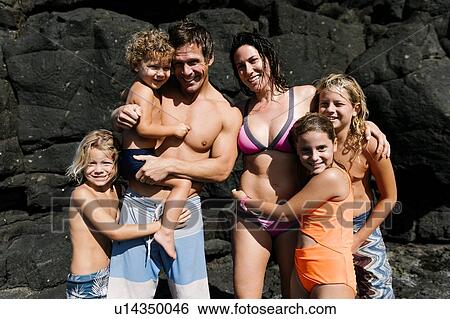Family portrait on rocks at beach View Large Photo Image Stock Photograph - Family portrait on rocks at beach. Fotosearch