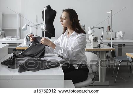 Fashion designer working in studio View Large Photo Image Stock Image - Fashion designer working in studio. Fotosearch