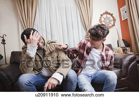 Father and son playing video game View Large Photo Image Stock Image - Father and son playing video game. Fotosearch