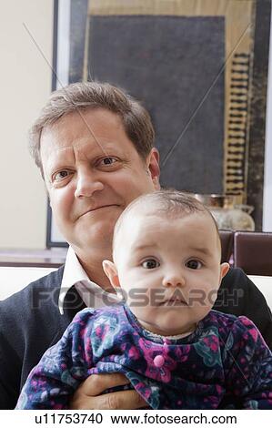 Father holding his baby girl View Large Photo Image Stock Image - Father holding his baby girl. Fotosearch