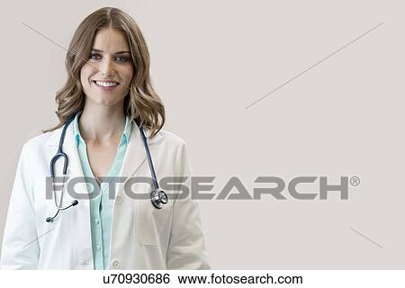 Stock Photograph - Female doctor smiling towards camera.. Fotosearch