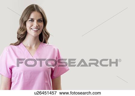 Stock Photo - Female nurse smiling towards camera.. Fotosearch