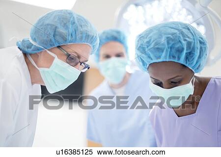 Female surgeons in operating theatre. View Large Photo Image Stock Photography - Female surgeons in operating theatre.. Fotosearch