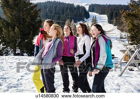 Five teenage girl skiers laughing in snow covered landscape, rear view, Tyrol, Styria, Austria View Large Photo Image Stock Image - Five teenage girl skiers laughing in snow covered landscape, rear view, Tyrol, Styria, Austria. Fotosearch
