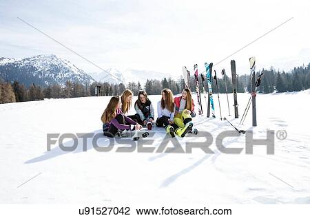 Five teenage girl skiers sitting in snow covered landscape, Tyrol, Styria, Austria View Large Photo Image Stock Image - Five teenage girl skiers sitting in snow covered landscape, Tyrol, Styria, Austria. Fotosearch