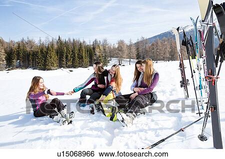 Five teenage girl skiers sitting in snow covered landscape, Tyrol, Styria, Austria View Large Photo Image Stock Photograph - Five teenage girl skiers sitting in snow covered landscape, Tyrol, Styria, Austria. Fotosearch
