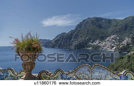 Stock Photograph - Flower pot on wall in Positano on Amalfi Coast, Italy. Fotosearch