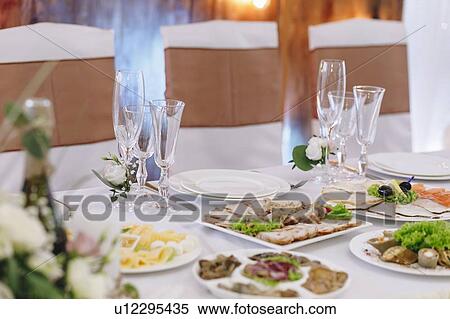 Food and place setting during wedding View Large Photo Image Stock Photography - Food and place setting during wedding. Fotosearch