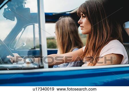 Stock Photo - Friends on road trip. Fotosearch