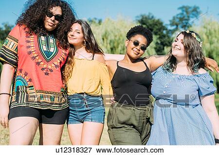 Stock Photo - Friends posing in park. Fotosearch