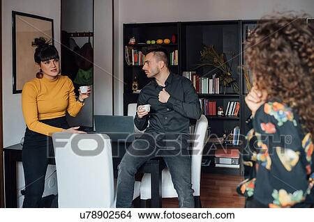 Friends relaxing with coffee at home View Large Photo Image Picture - Friends relaxing with coffee at home. Fotosearch