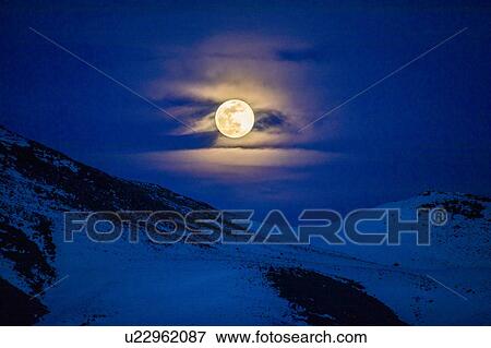 Full moon over mountains at night in Bellevue, Idaho, USA View Large Photo Image Stock Photo - Full moon over mountains at night in Bellevue, Idaho, USA. Fotosearch