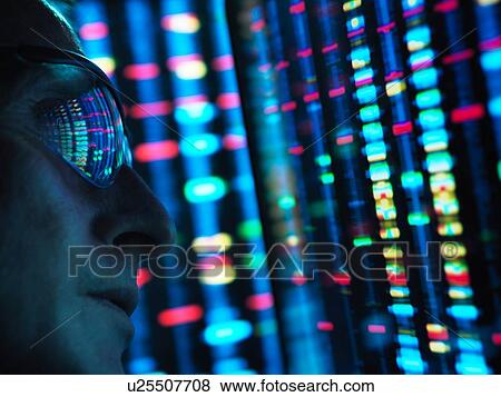 Stock Photo - Genetic Research, scientist viewing DNA information on screens, close up. Fotosearch