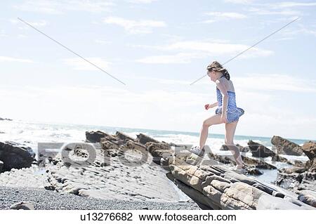 Girl exploring beach View Large Photo Image Stock Image - Girl exploring beach. Fotosearch