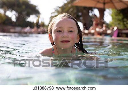 Girl swimming in pool View Large Photo Image Stock Photo - Girl swimming in pool. Fotosearch