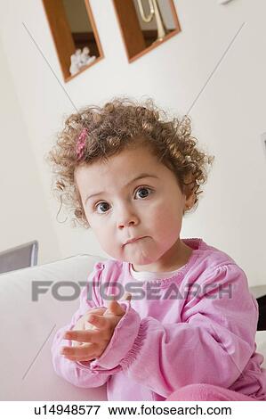 Stock Photo - Girl with curly brown hair. Fotosearch