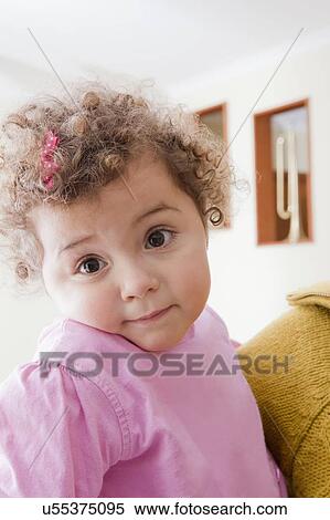 Stock Photography - Girl with curly brown hair. Fotosearch