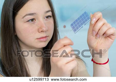 Girl working on electronics project. View Large Photo Image Stock Image - Girl working on electronics project.. Fotosearch
