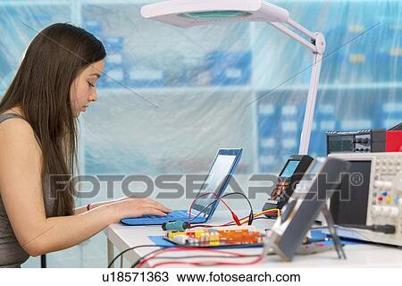 Girl working on electronics project. View Large Photo Image Stock Image - Girl working on electronics project.. Fotosearch