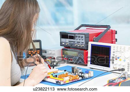 Girl working on electronics project. View Large Photo Image Stock Image - Girl working on electronics project.. Fotosearch