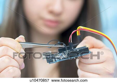 Girl working on electronics project. View Large Photo Image Stock Photo - Girl working on electronics project.. Fotosearch