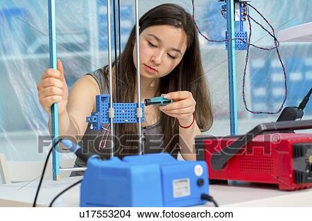 Girl working on robotics project. View Large Photo Image Picture - Girl working on robotics project.. Fotosearch