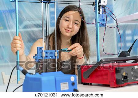 Girl working on robotics project. View Large Photo Image Stock Image - Girl working on robotics project.. Fotosearch