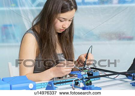 Girl working on robotics project. View Large Photo Image Stock Photo - Girl working on robotics project.. Fotosearch