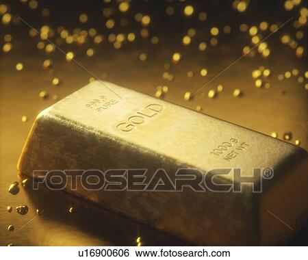 Stock Photograph - Gold bar and nuggets, studio shot.. Fotosearch