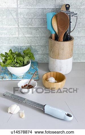 Picture - Grater with garlic on kitchen counter. Fotosearch