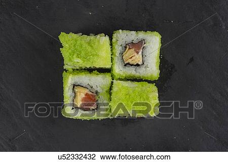 Green fish roe sushi on black surface View Large Photo Image Stock Image - Green fish roe sushi on black surface. Fotosearch