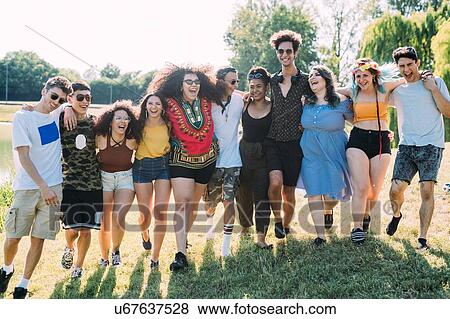 Group of friends dancing in park View Large Photo Image Stock Photo - Group of friends dancing in park. Fotosearch